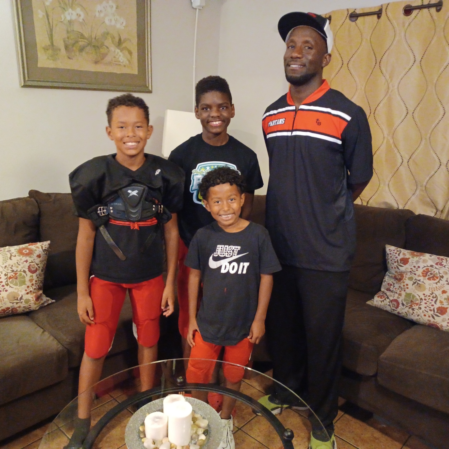 Zachry with his dad and brothers at home
